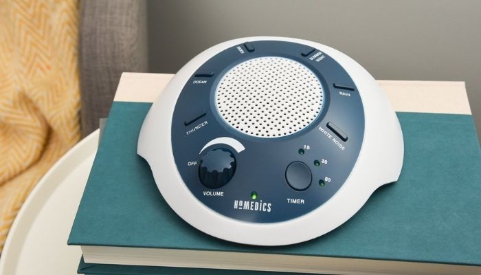 white noise machine over a book
