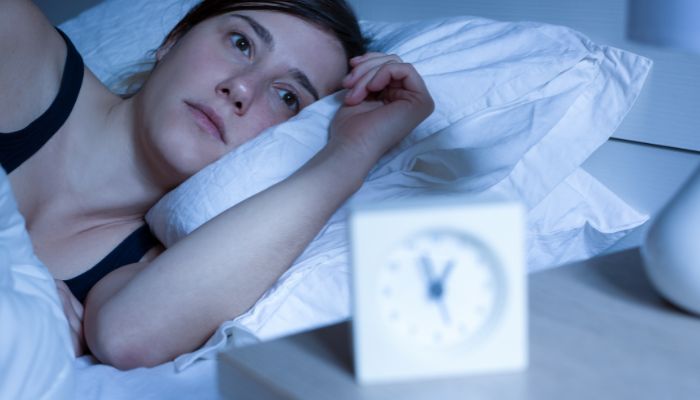 woman not being able to sleep at night with clock showing time
How to Sleep When Can’t Stop Thinking?