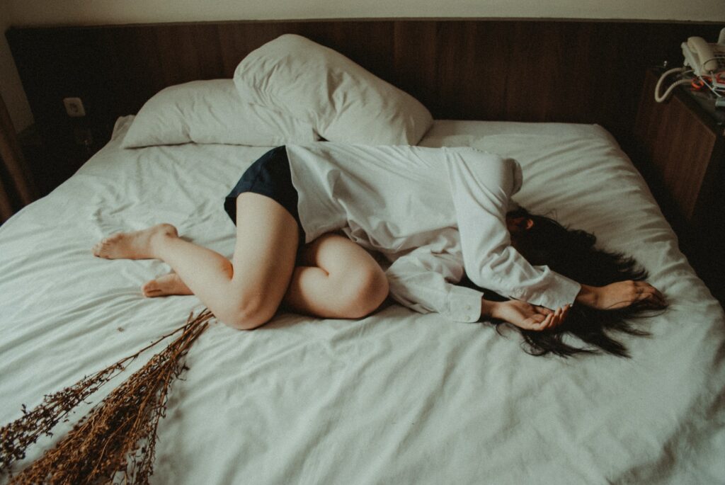 woman lying on bed
restless sleep