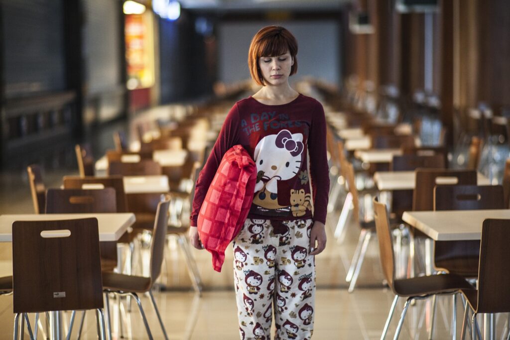 women wearing maroon t shirt doing sleep walking
why do people sleepwalk