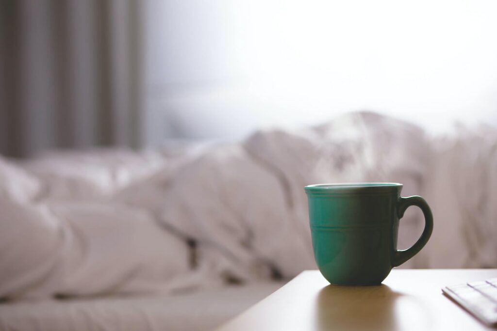 green ceramic mug on wooden desk
sleep inertia
