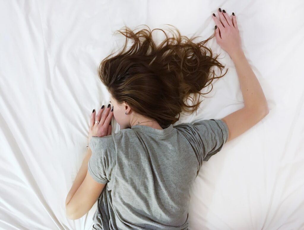 women sleeping wearing grey t shirt