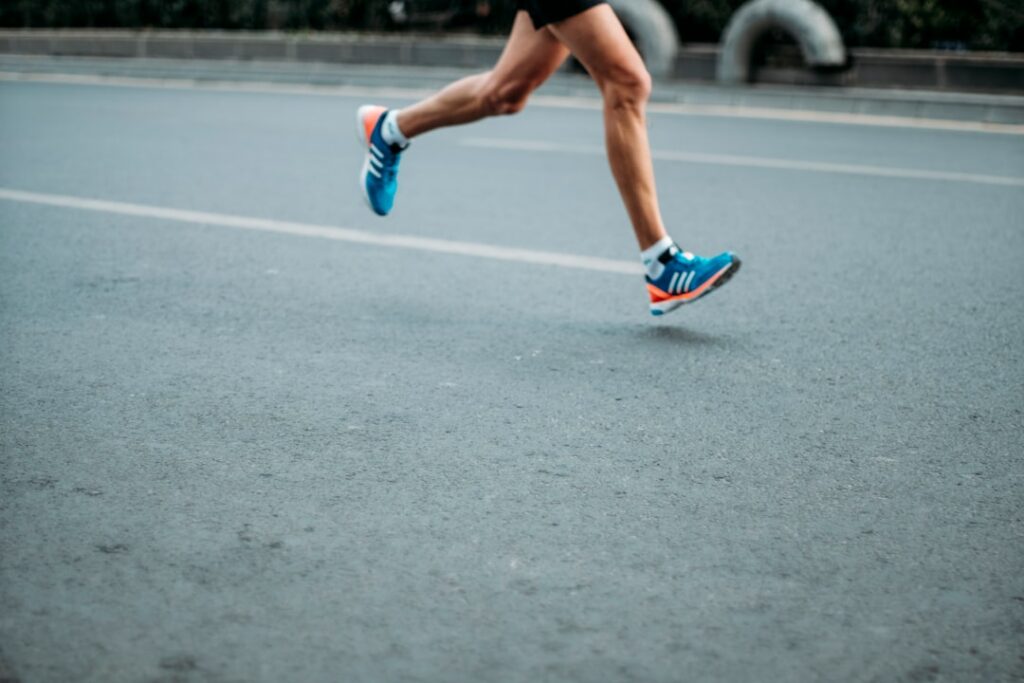 legs running on road